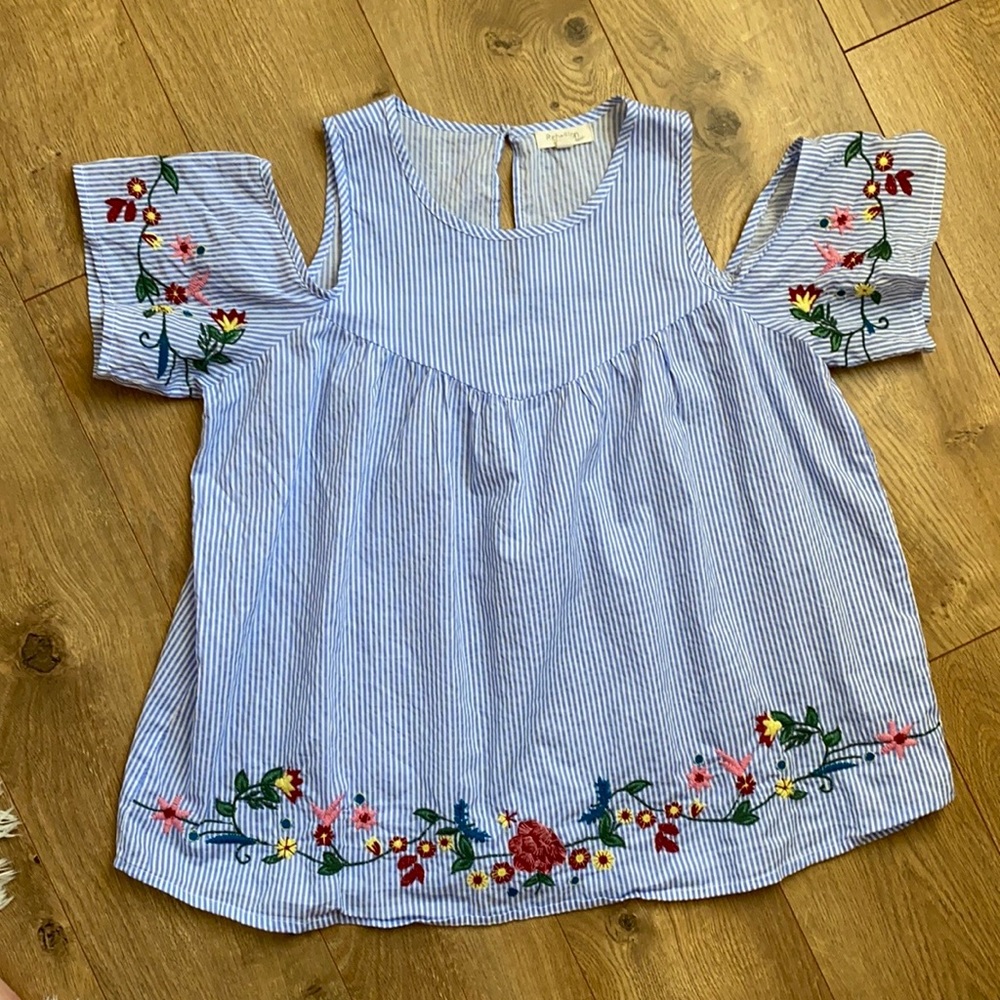 Beautiful blouse with floral embroidery detail